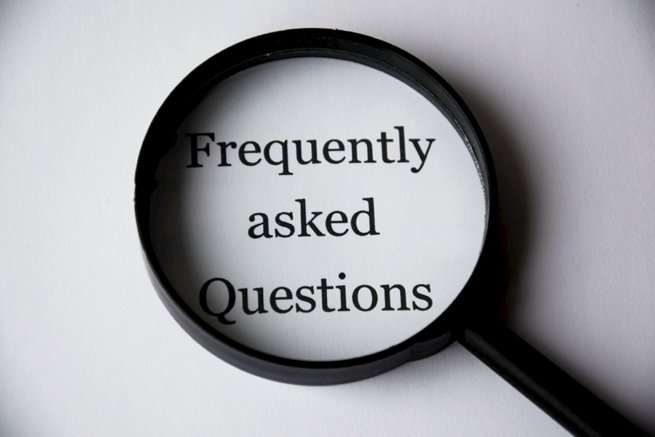 Frequently asked question typed copy under a microscope | Kelly Chandler Consulting