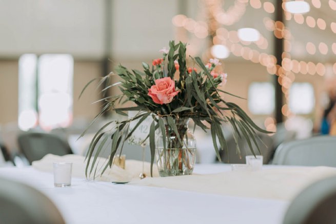 Vase coral flower and leaves in table centrepiece | Kelly Chandler Consulting 
