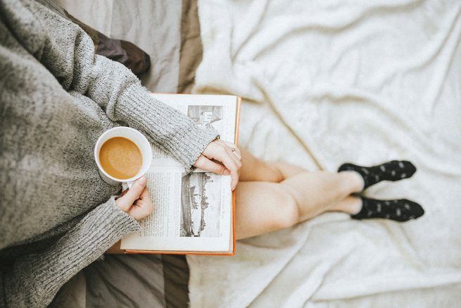 girl with a coffee reading | kelly chandler Consulting