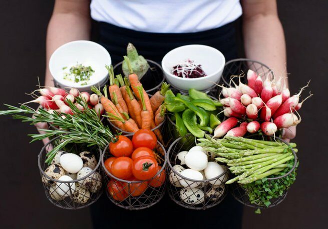 Vibrant fresh vegetable produce being held on a tray | Kelly Chandler Consulting